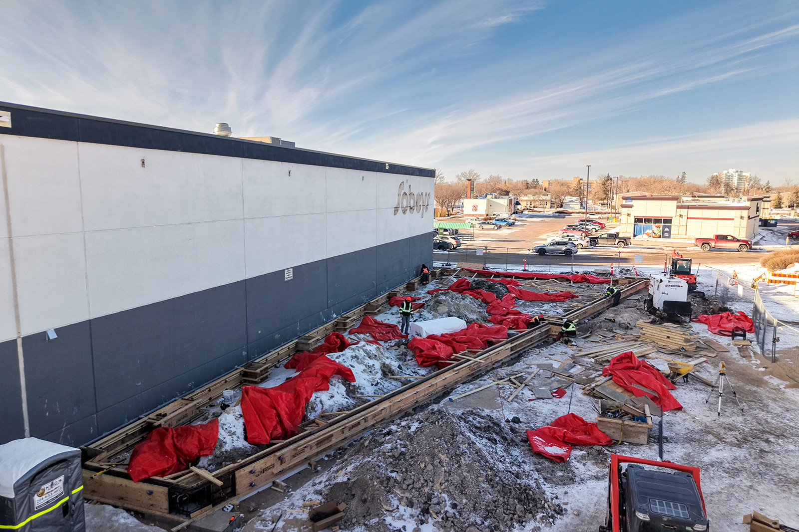 1148 Taylor - New Construction - Grade beam formwork under winter protection