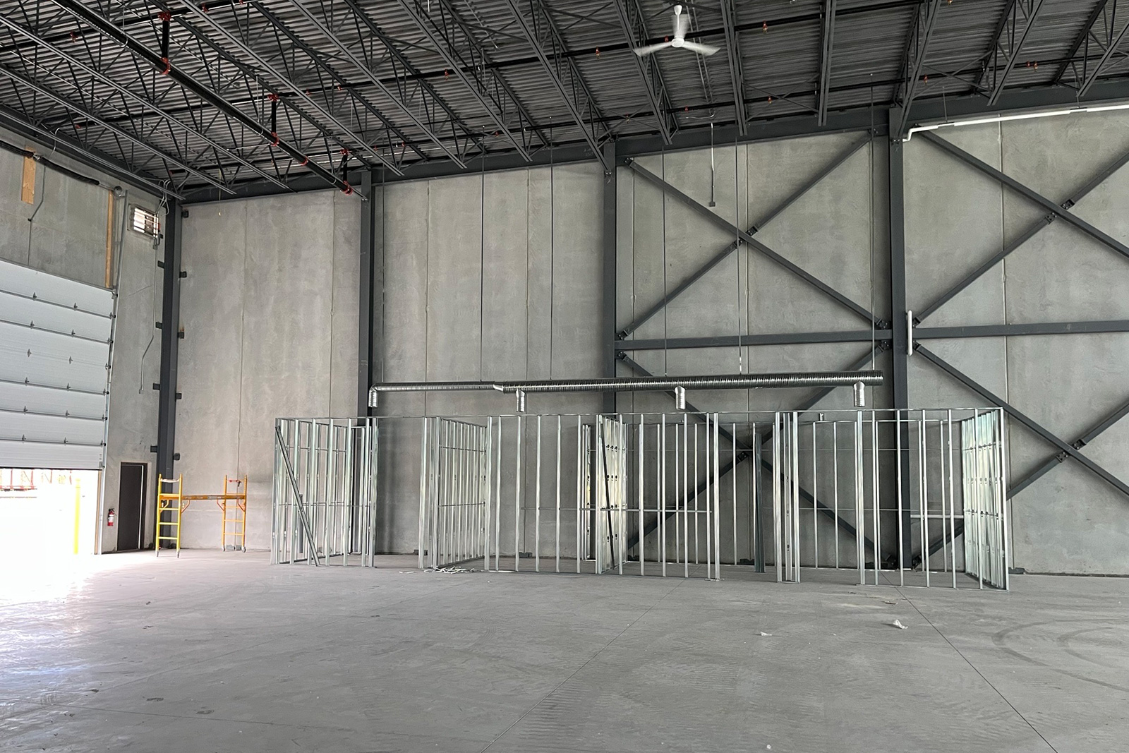 Artik - Tenant Fit Up - Office stud framing against the warehouse wall